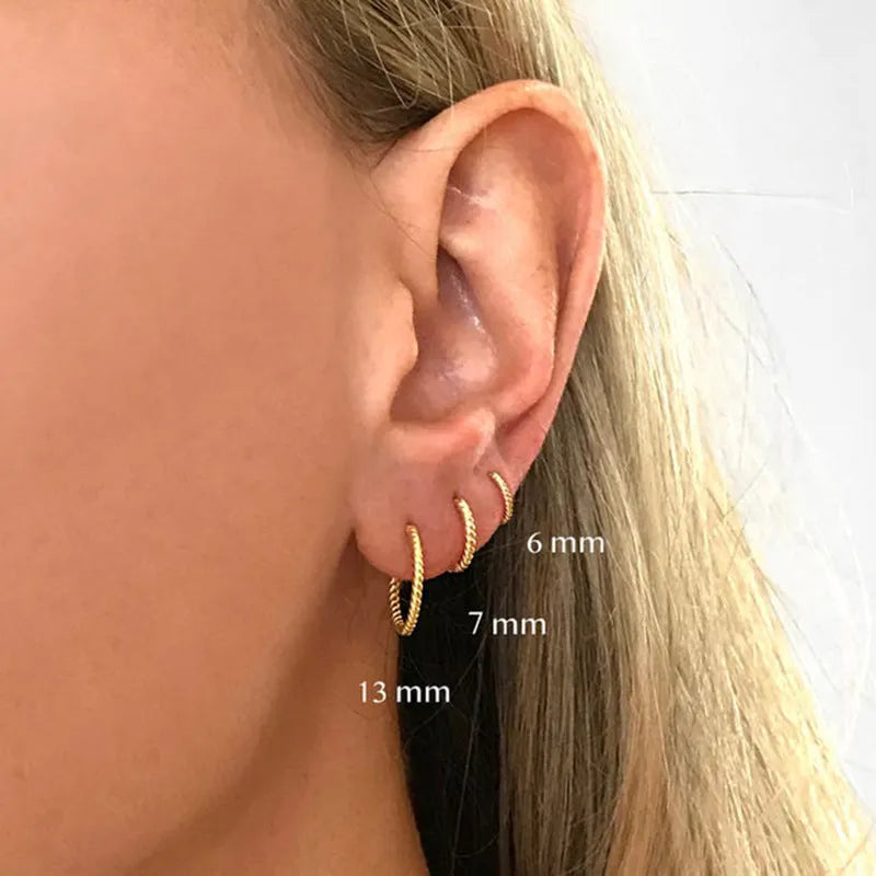 Sterling silver twisted ring earrings in geometric round design with gold or platinum finish