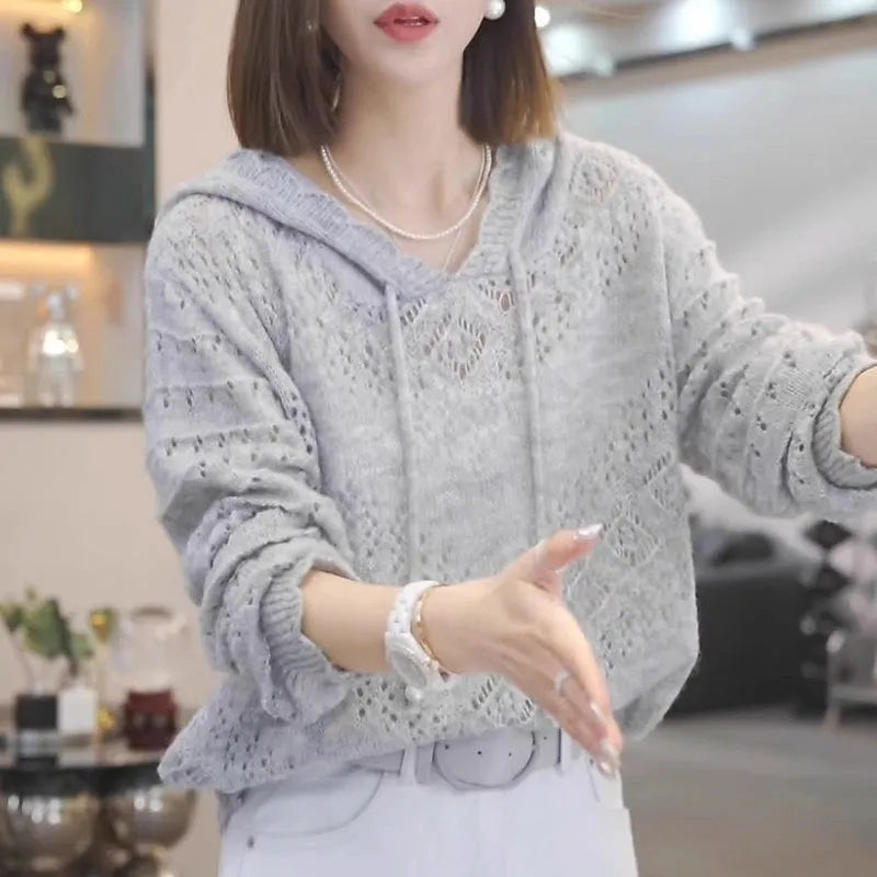 Women's loose-fitting crochet hollow hooded longsuit undershirt in a knit fabric, shown in blue.