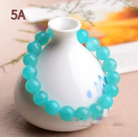 Amazonite natural scattered beads in ice colour showing polished surface and hole drilling