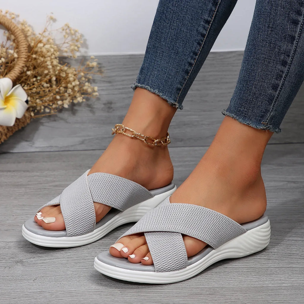 Women's black peep toe wedge slippers with a fish mouth design and thick rubber sole.