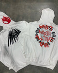 Black hooded sweatshirt with printed white skull pattern and rhinestone details, loose cardigan style