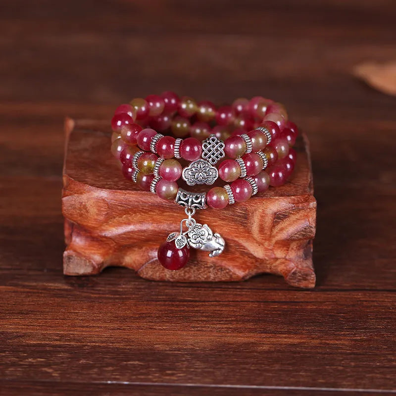 Handcrafted natural watermelon crystal bracelet with geometric beads and Chinese knot adjustable closure