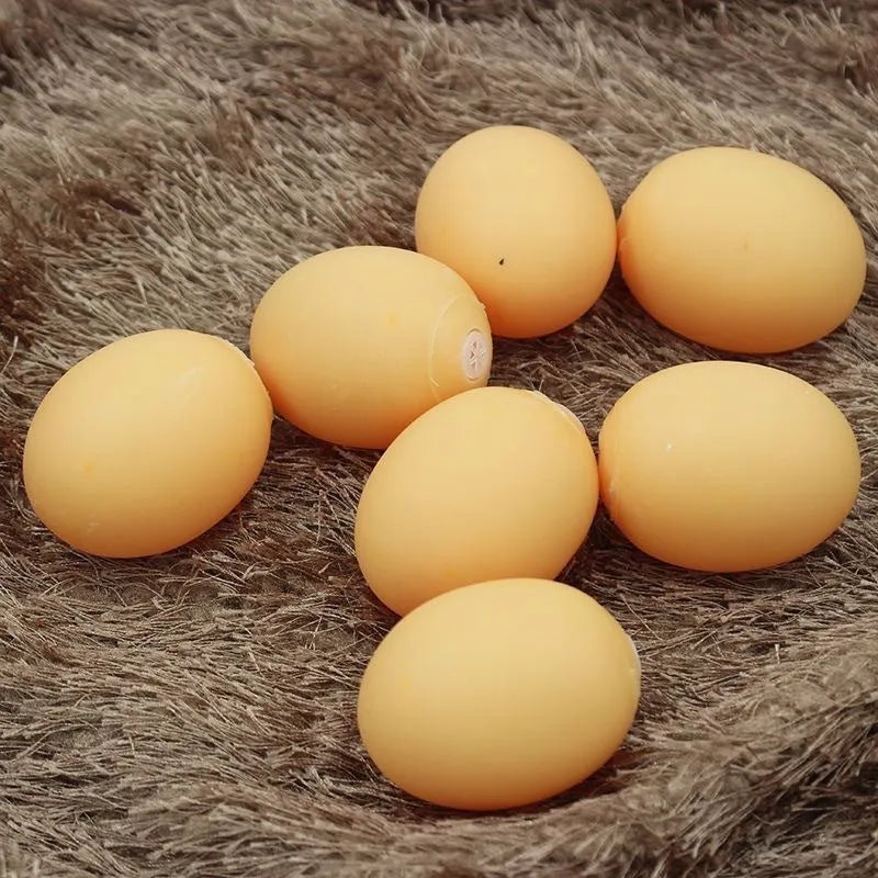 Green durable rubber dog chew ball toy with sound simulation egg inside for teeth cleaning.