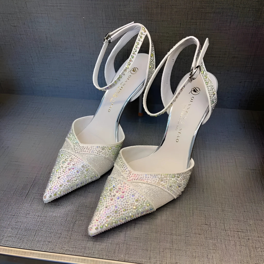 Women's black hollow high heels with red sole, stiletto heel and pointed toe design