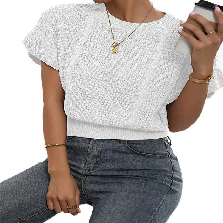 White knitted pullover sweater with 3D twisted string pattern and ruffled short sleeves on a hanger.