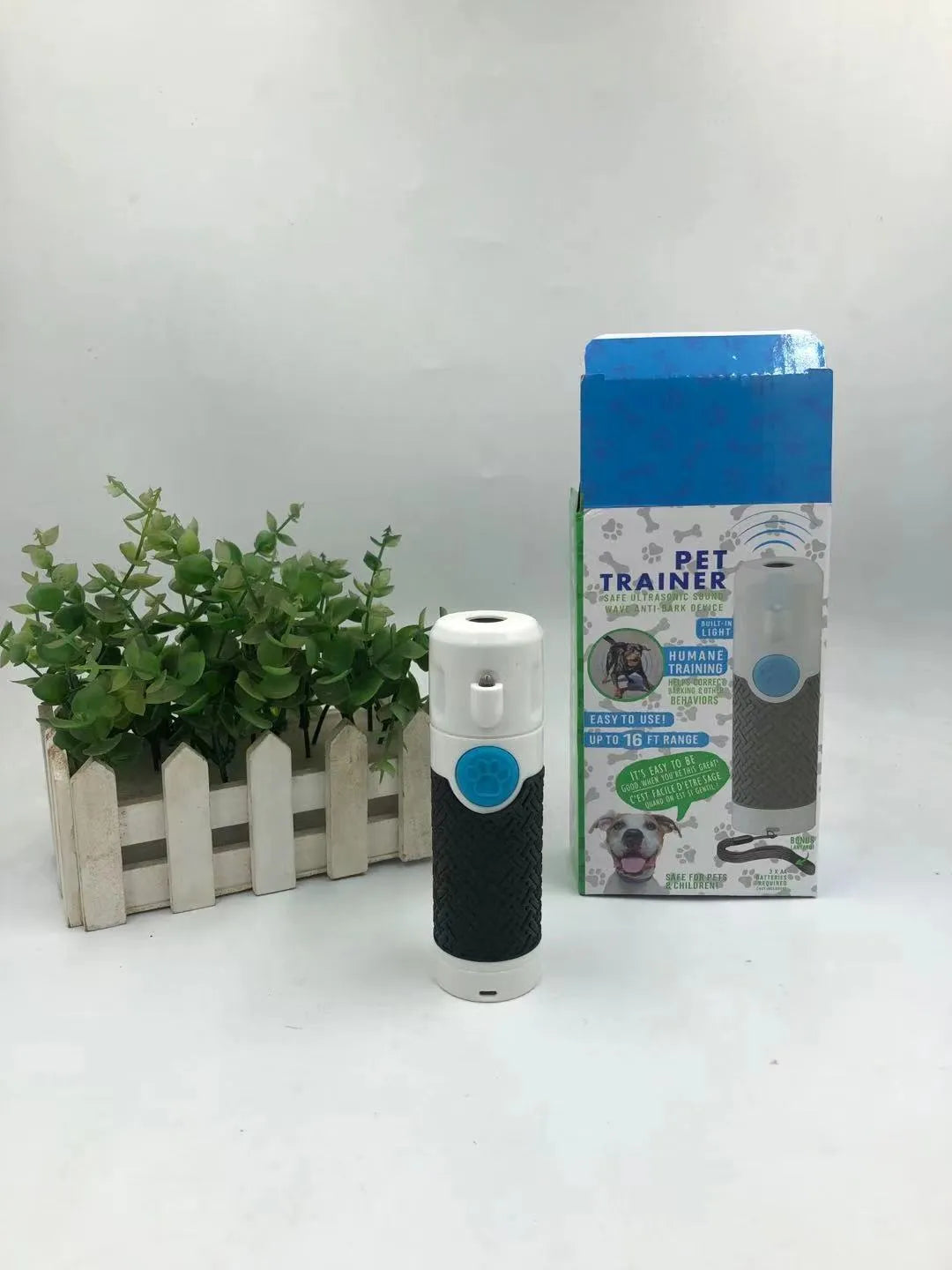 White ABS plastic ultrasonic dog trainer handheld device for bark control weighing 100g