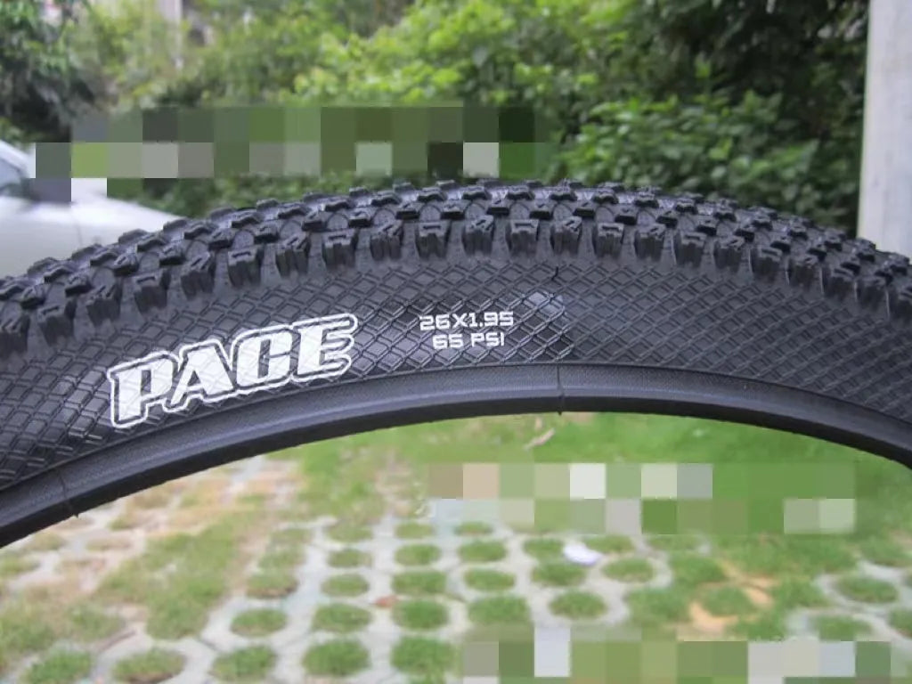 Mountain bike tyre with puncture-proof construction, shown in multiple sizes including 26x1.95 and 27.5x2.1