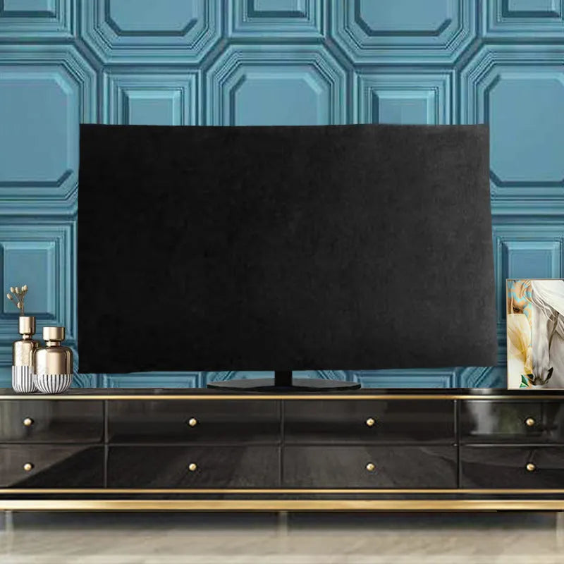 A pink velvet television cover draped over a flat-screen TV, showing its elasticated hem and soft fabric texture.