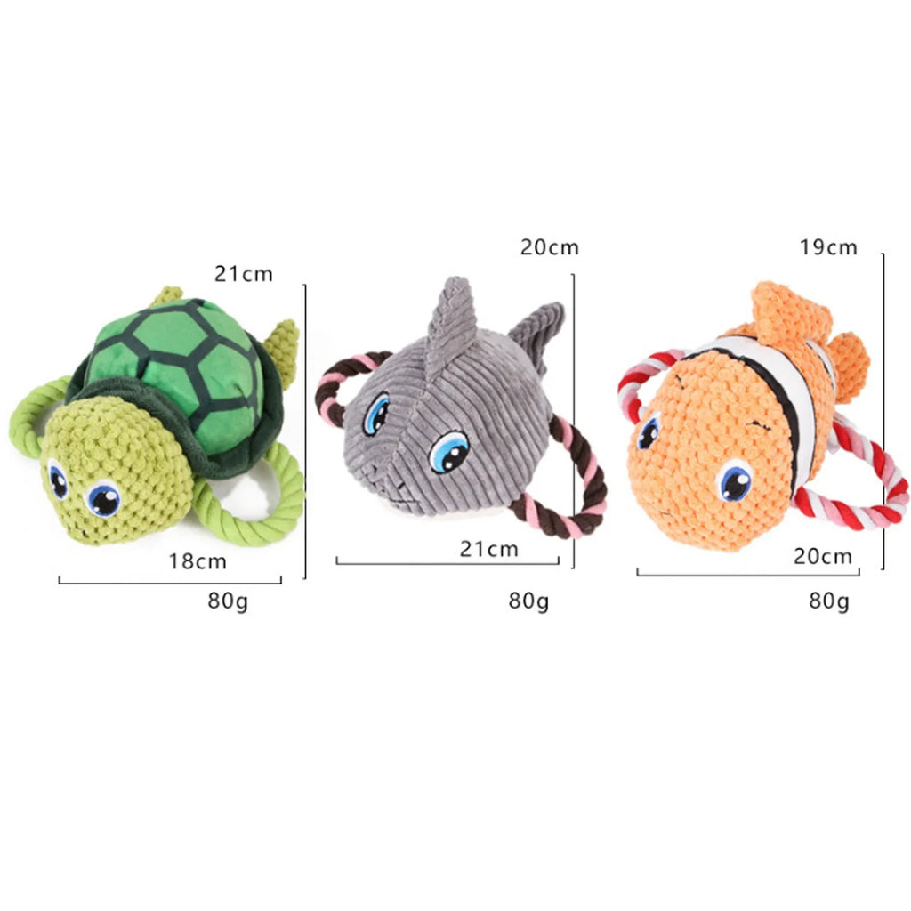 Turtle shaped dog chewing toy in gray green or orange plush fabric with knotted limbs for interactive pet play