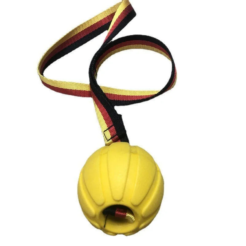 Floating camouflage and yellow EVA dog training balls with string tethers in three different sizes