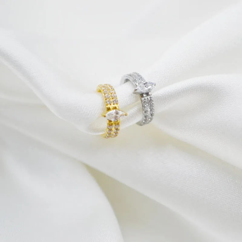Gold and silver titanium steel heart earrings with zircon stones measuring 1.2x8mm