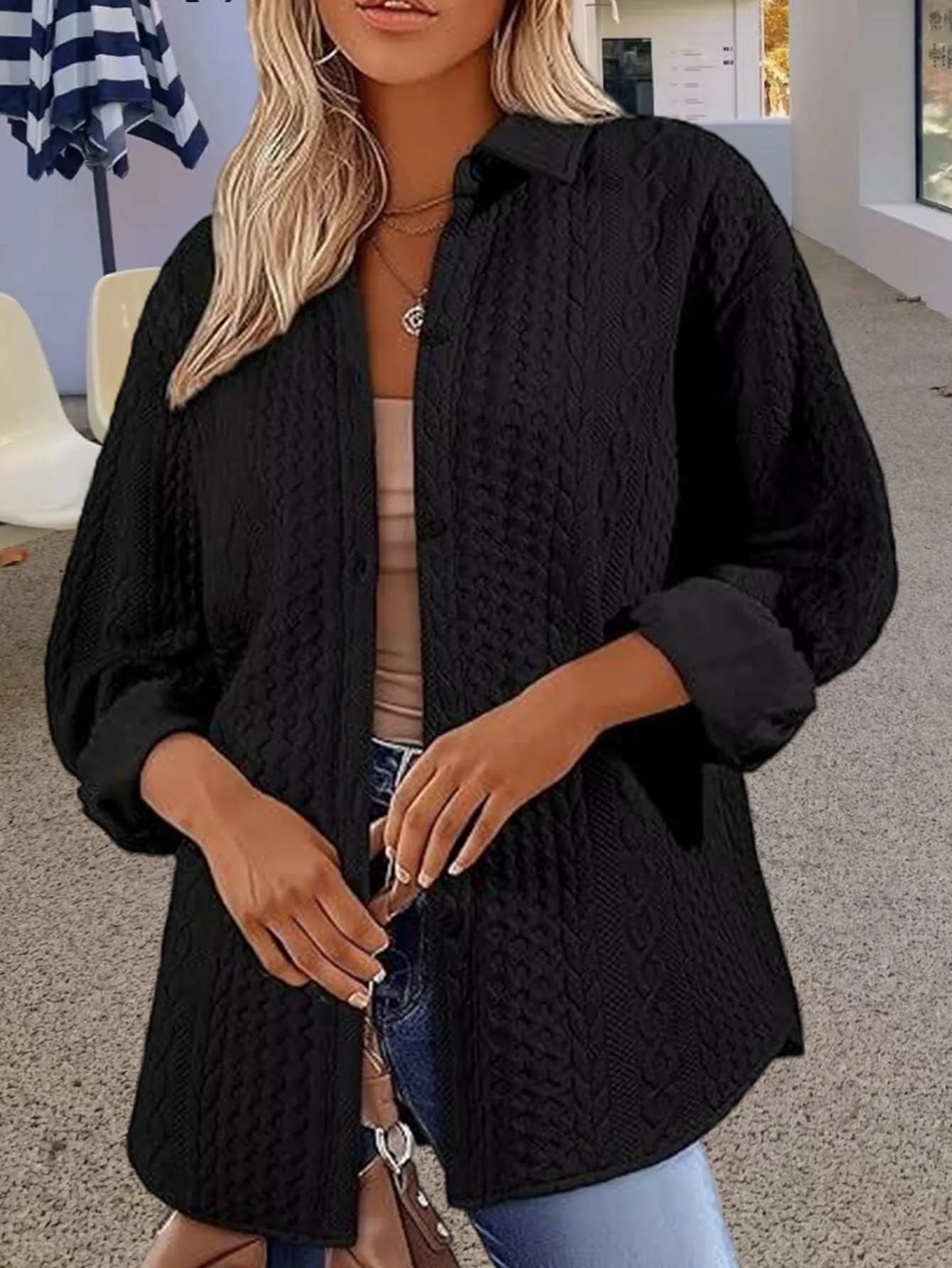 Women's solid colour long-sleeved knitted cardigan sweater in black, shown in a cardigan style.