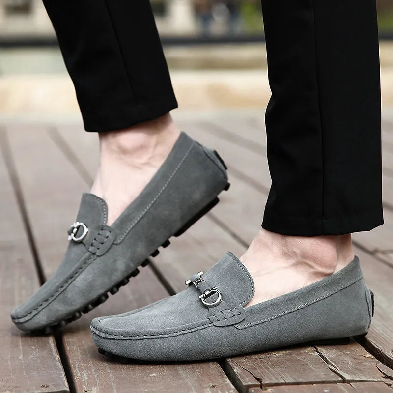 Men's black slip-on cowhide leather shoes with a square toe and flat heel on a white background