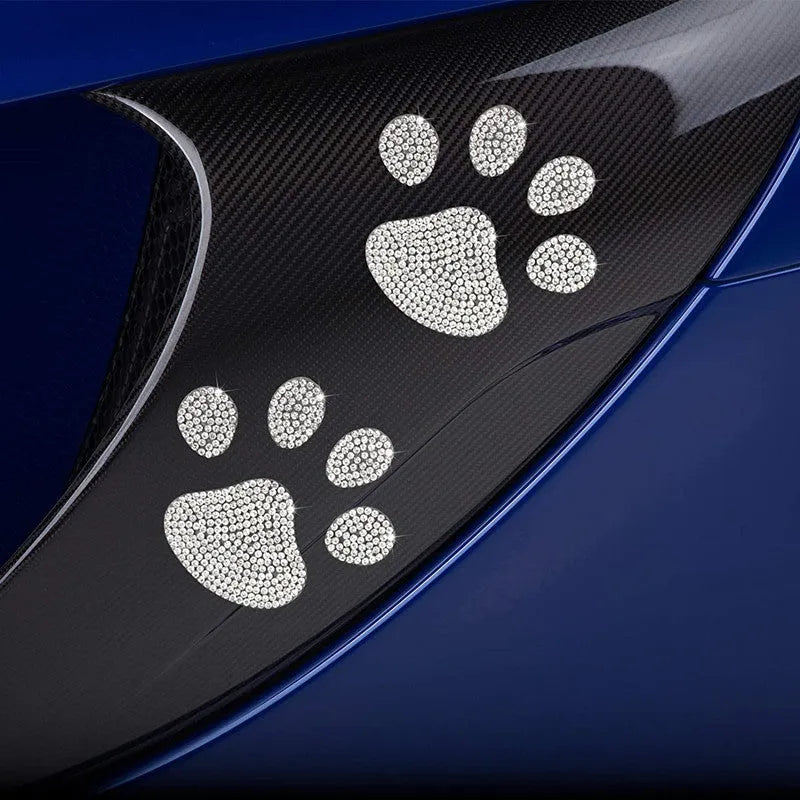 Close-up of a diamond-encrusted butterfly and bear claw design on a 7x6cm glass car sticker