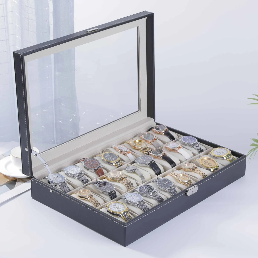 Grey leather watch storage box with clear lid showing watch compartments