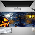 Large Halloween-themed computer mouse pad with graphic design on a desk