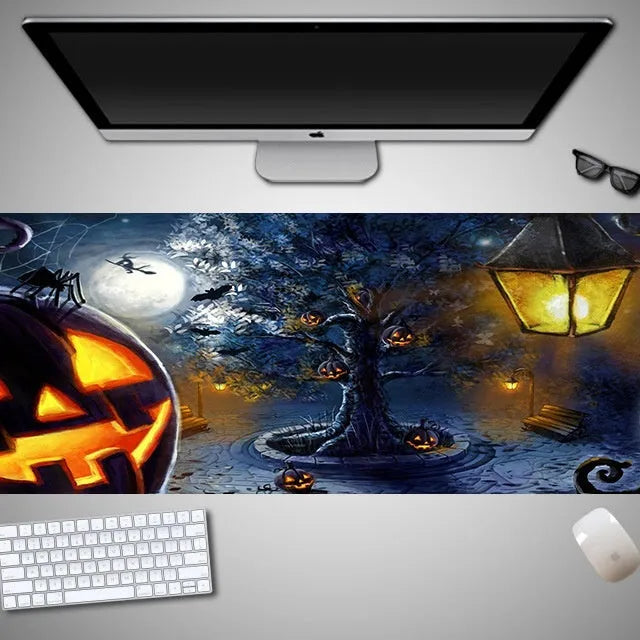 Large Halloween-themed computer mouse pad with graphic design on a desk