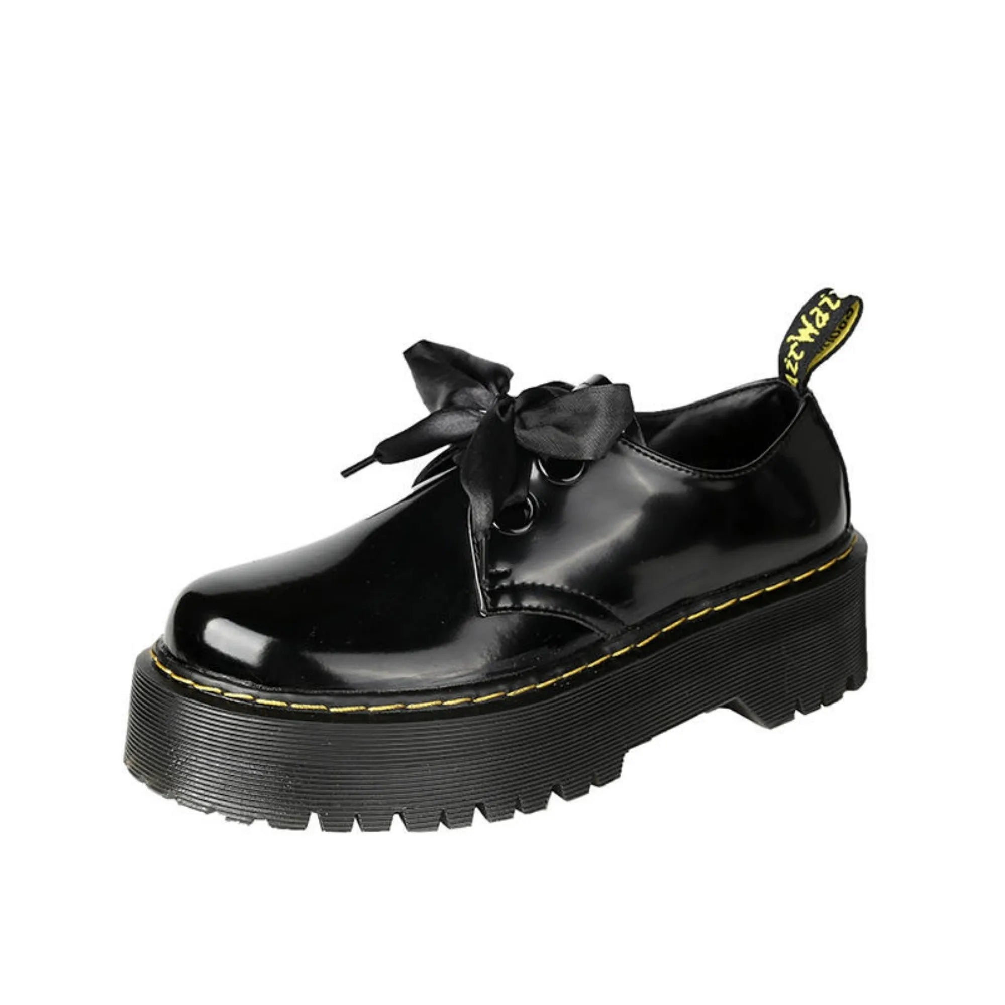 Women's black thick soled lace-up shoes with ribbon detail on a white background