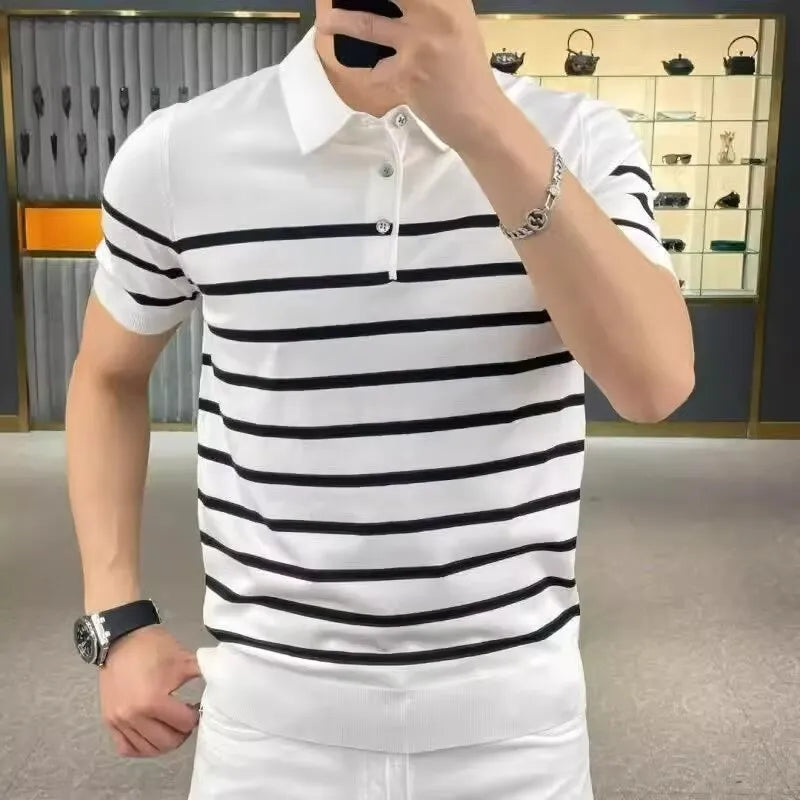 Man wearing a black and white striped knitted t-shirt with a lapel collar, showcasing a smart-casual look.