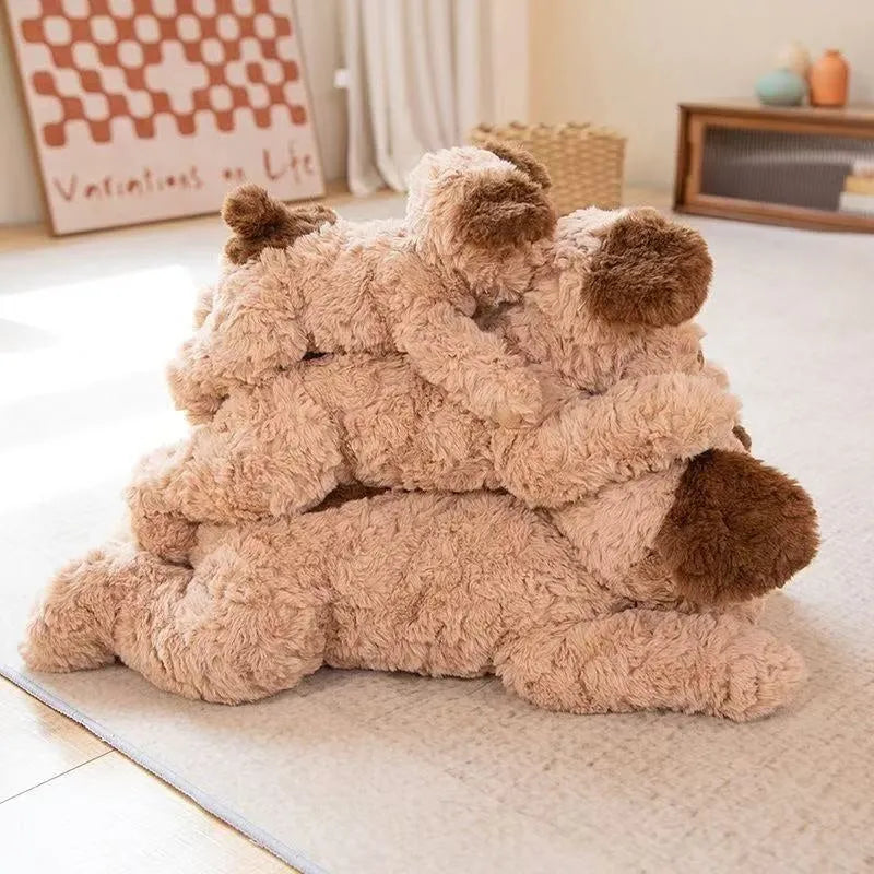 Plush toy lying dog doll in brown faux fur, 35cm height, lying on a soft surface