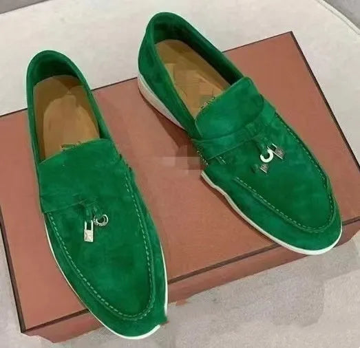 Unisex high-top slip-on loafers with a round toe cap and rubber sole on a neutral background.
