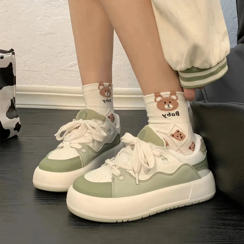 Women's green casual shoes with a round toe and flat heel, made from breathable PU mesh.