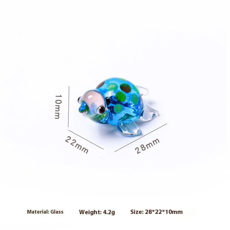 Geometric glass turtle desktop ornament in modern simplicity style on a wooden surface.