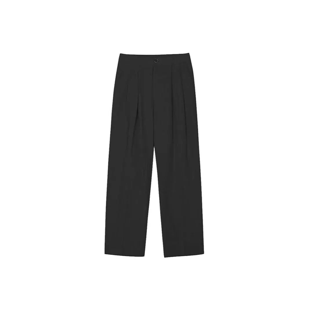 Men's lightweight apricot coloured wide-leg cotton linen trousers with a pencil leg opening on a hanger