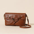 Genuine leather crossbody bag in Sugar Brown with sewing thread detail and clamshell opening
