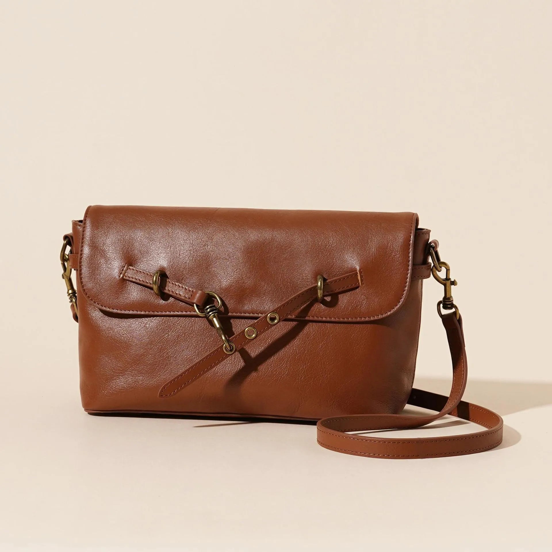 Genuine leather crossbody bag in Sugar Brown with sewing thread detail and clamshell opening