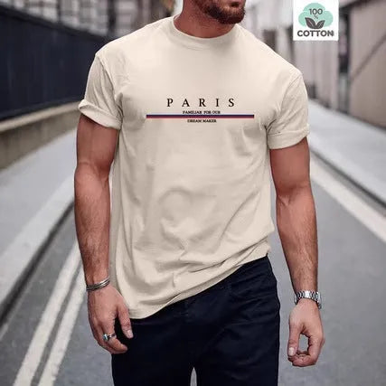 Man wearing a heavy loose-fit pure cotton T-shirt with a letter print on the chest in a casual setting.