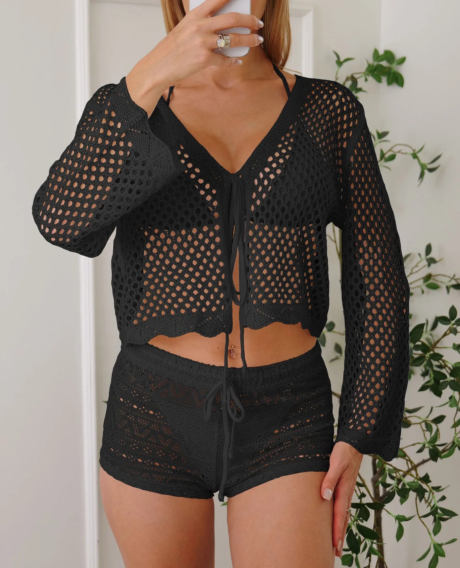 Short length women's cardigan blouse with bell sleeves in a choice of colours.