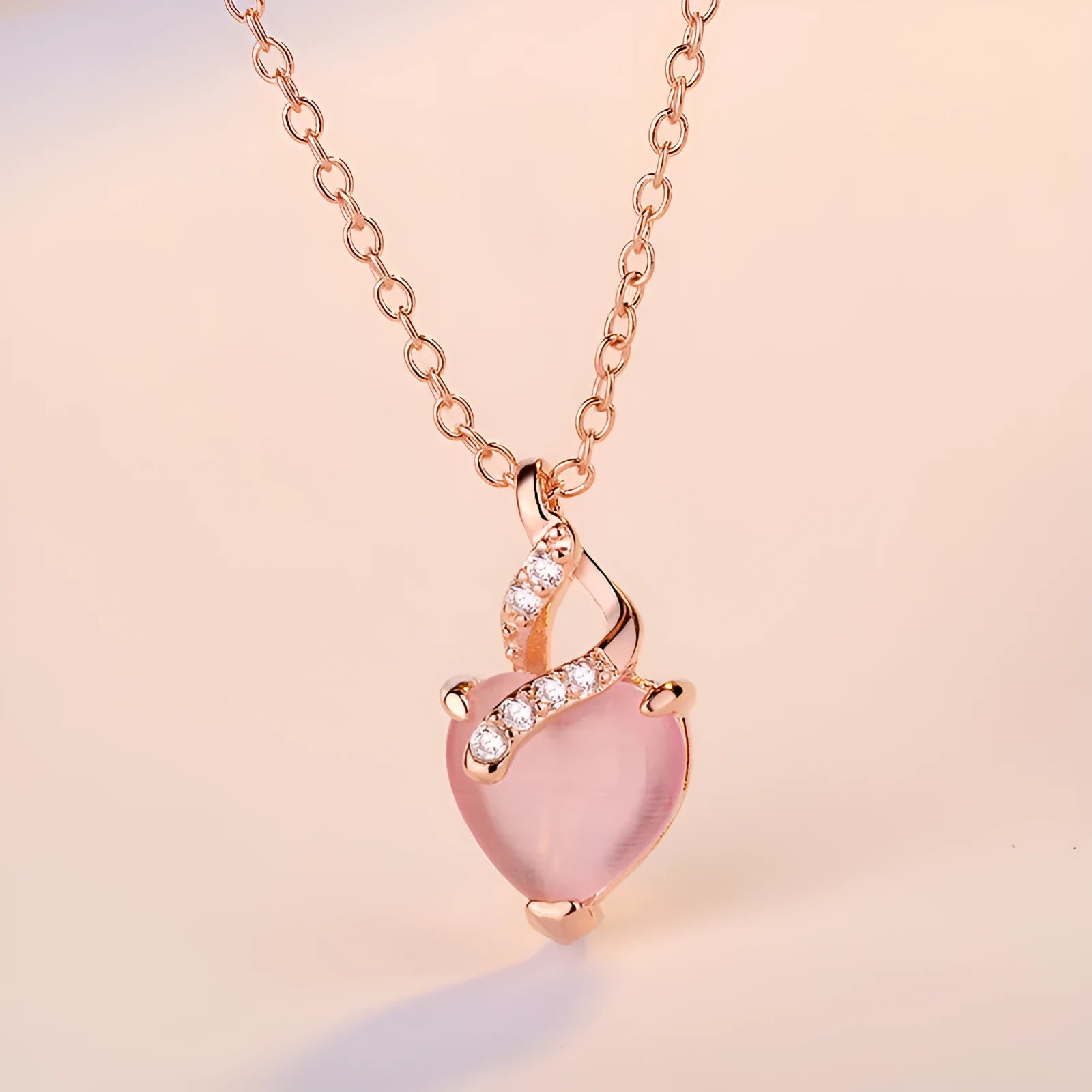 Women's heart-shaped artificial crystal pendant on rose gold electroplated cross chain necklace