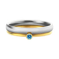 December colour birthstone engraved titanium steel ring with geometric design on a white background.
