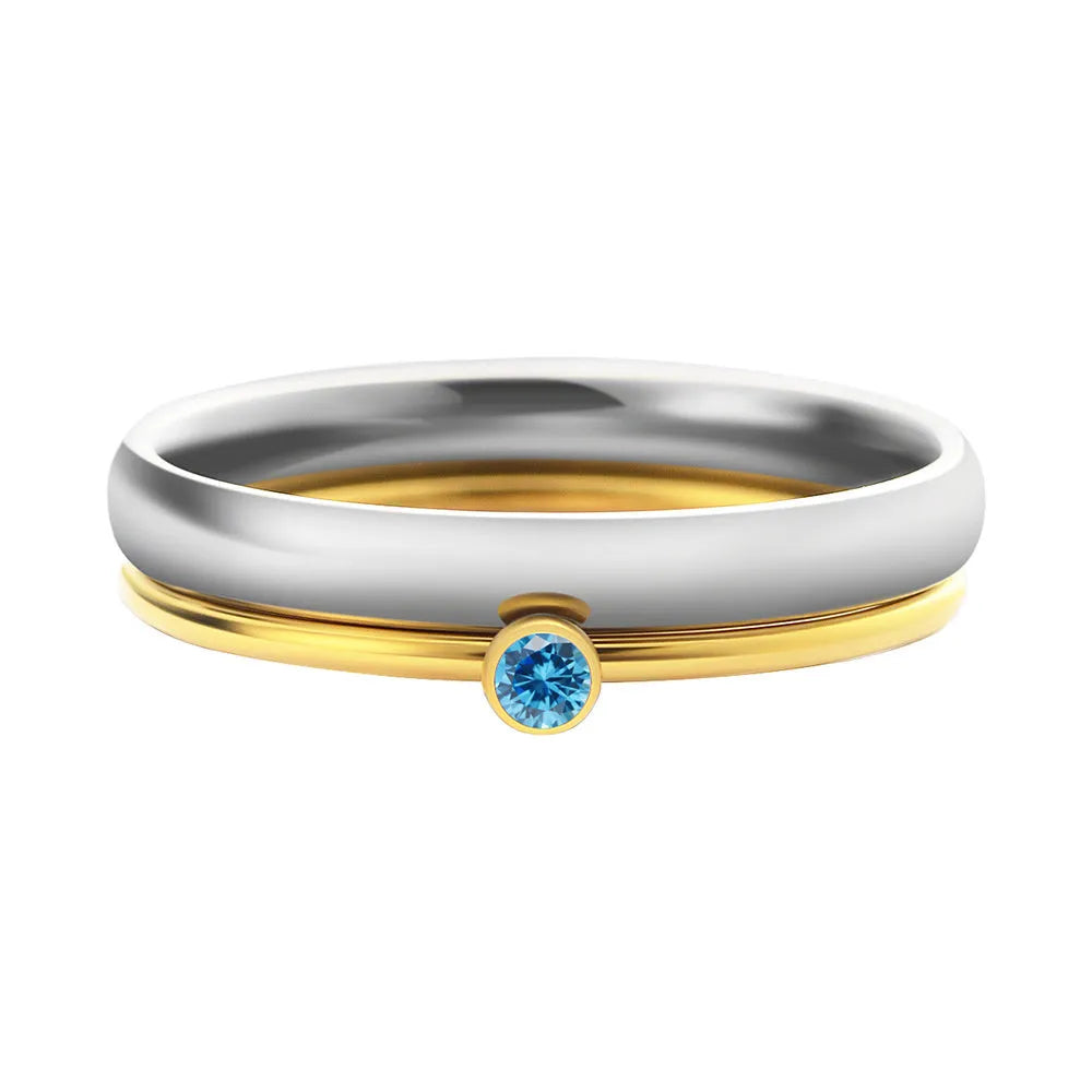 December colour birthstone engraved titanium steel ring with geometric design on a white background.