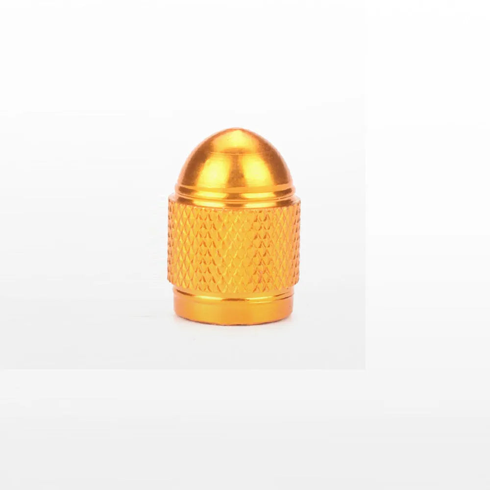 Aluminium alloy mountain bike tyre valve cap in multiple colour choices on a bicycle wheel.