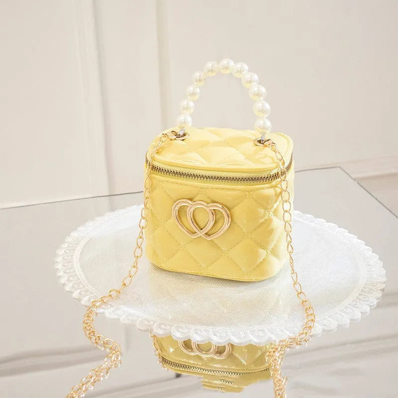White PVC bucket-shaped gel bag with a heart pattern visible inside the open top.
