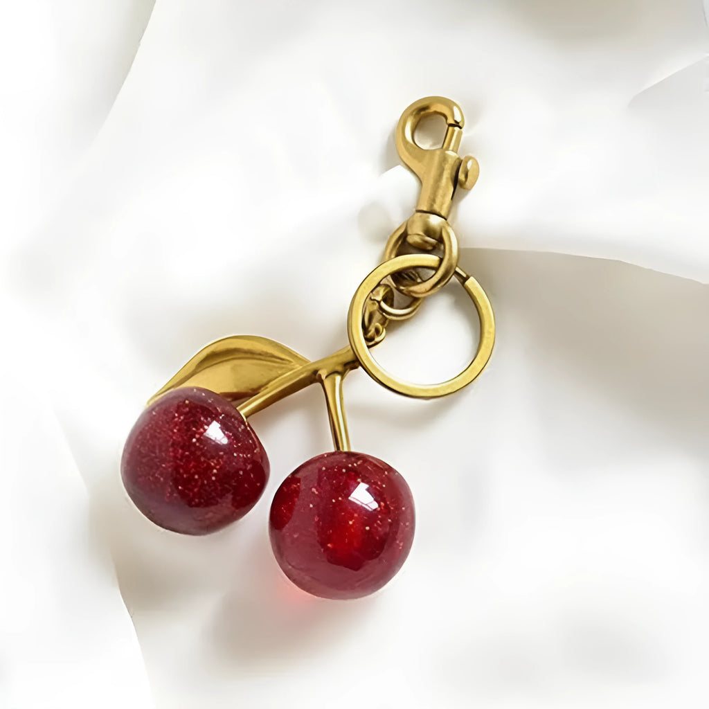 Red zinc alloy cherry-shaped keychain pendant with three-dimensional design