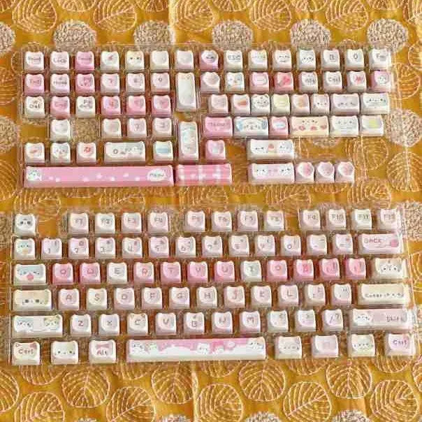 Meow Meow Team themed 141-piece PBT plastic key cap set for mechanical keyboards showing colourful sublimation print.