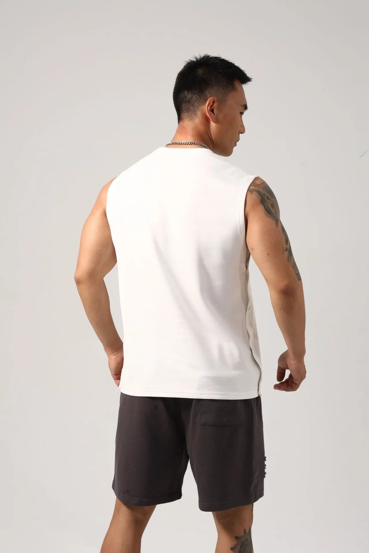 Korean style loose cotton fitness vest for men with hidden hook side openings.