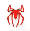 Three-dimensional metal spider-shaped bumper sticker in silver finish on a white background.