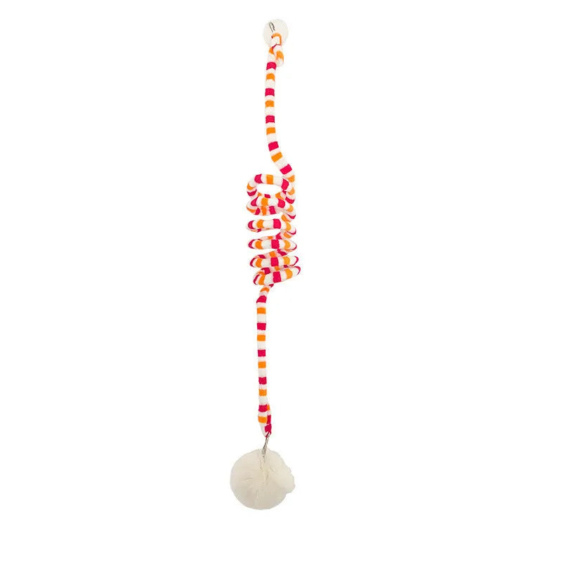 Kitten playing with hanging spring toy featuring inflatable ball and suction cup mount in various colours