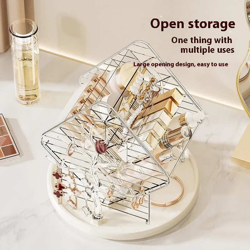 Rotating multi-tiered cosmetics storage box in clear transparent plastic on a wooden surface.
