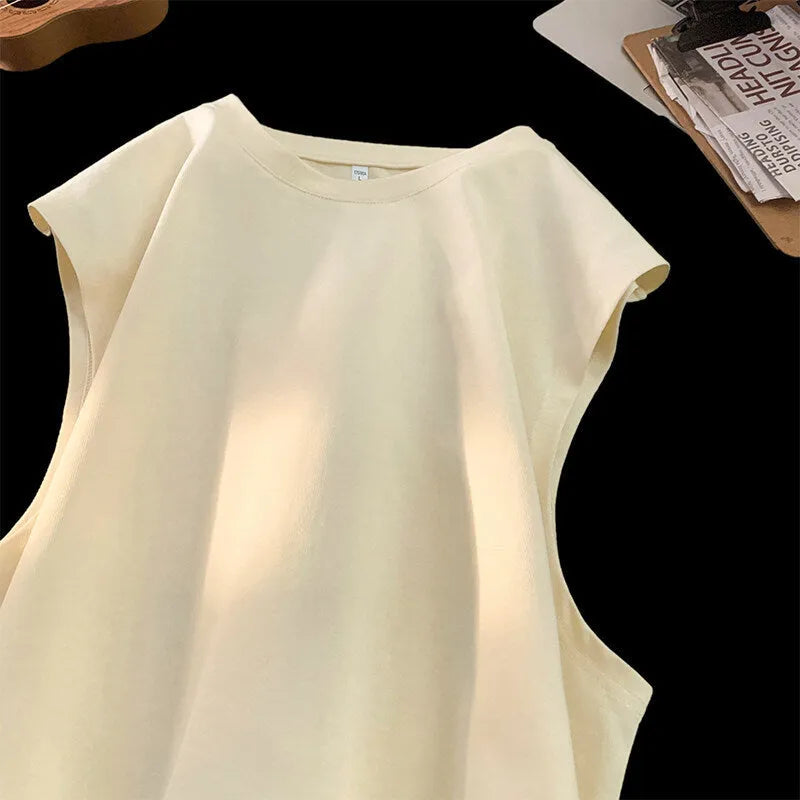 Men's loose solid colour cotton tank top sleeveless t-shirt on a hanger.
