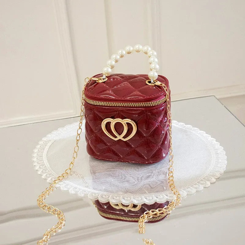 White PVC bucket-shaped gel bag with a heart pattern visible inside the open top.