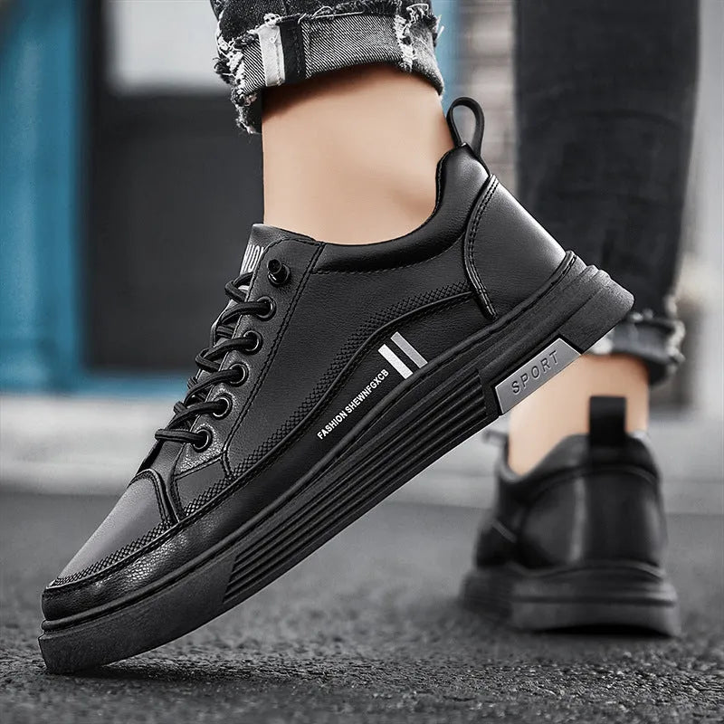 Men's white and black low-top skate shoes with an elastic band and round toe on a rubber sole.