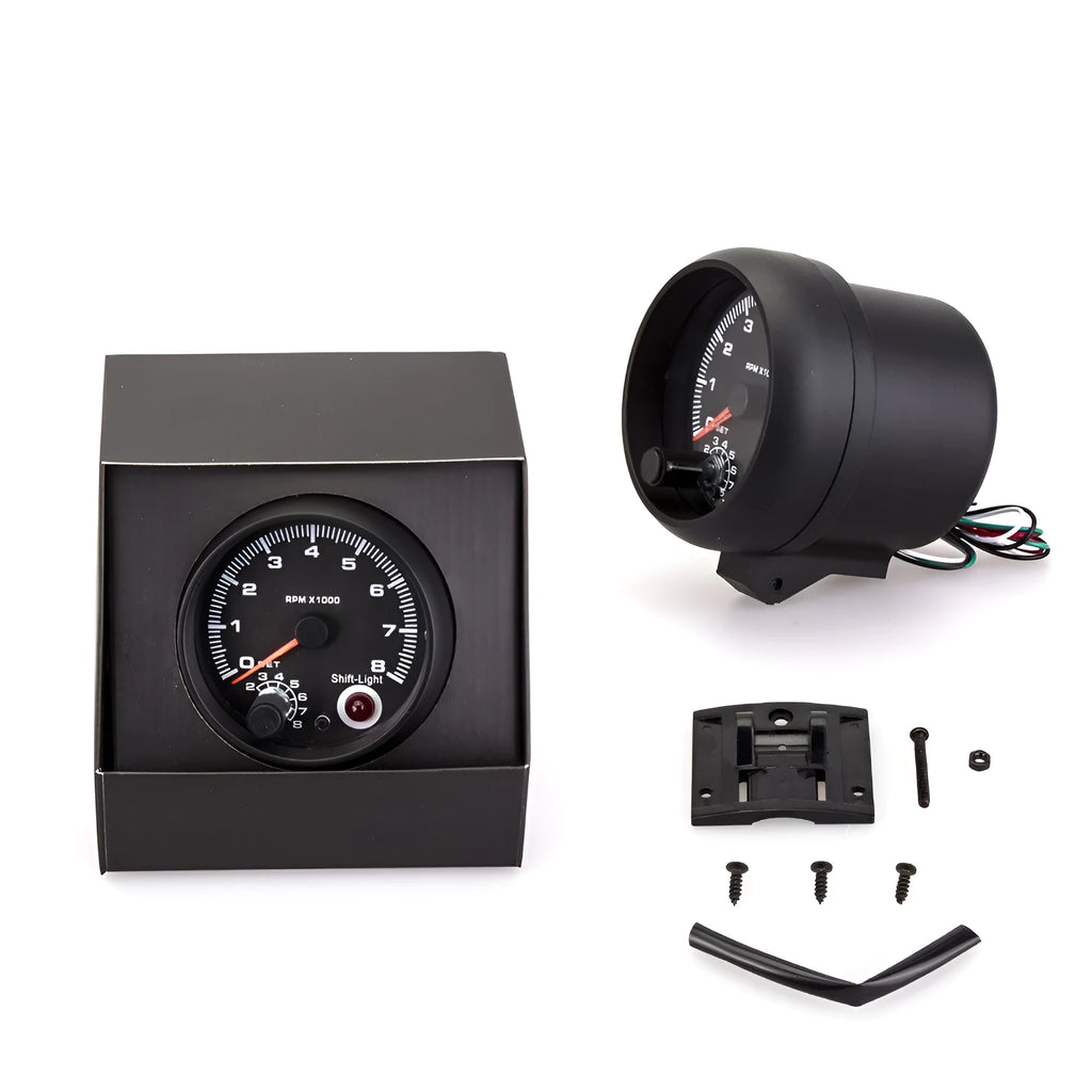Black automotive tachometer with blue light pointer showing RPM scale 00~8×1000