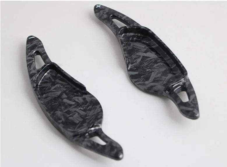 Carbon fibre steering wheel shift paddle in ABS plastic showing five colour finish options