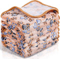 Coral fleece dog blanket with paw print design, shown in camel colour, laid flat.