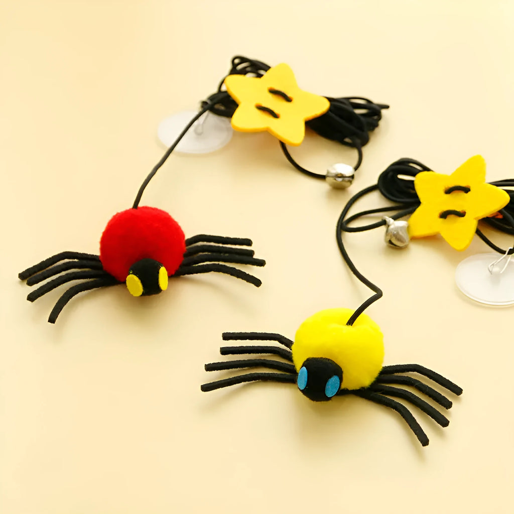 Cat hanging door toy with elastic rope, feather, bell and spider attachment in red colour